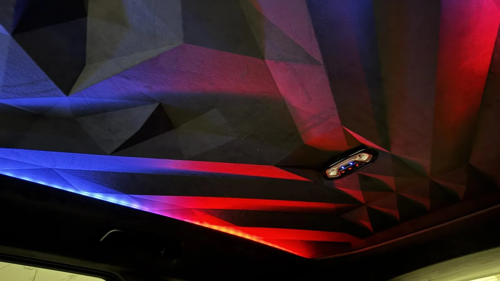 2024 BMW XM — Patterned headlining lit by the ambient lighting