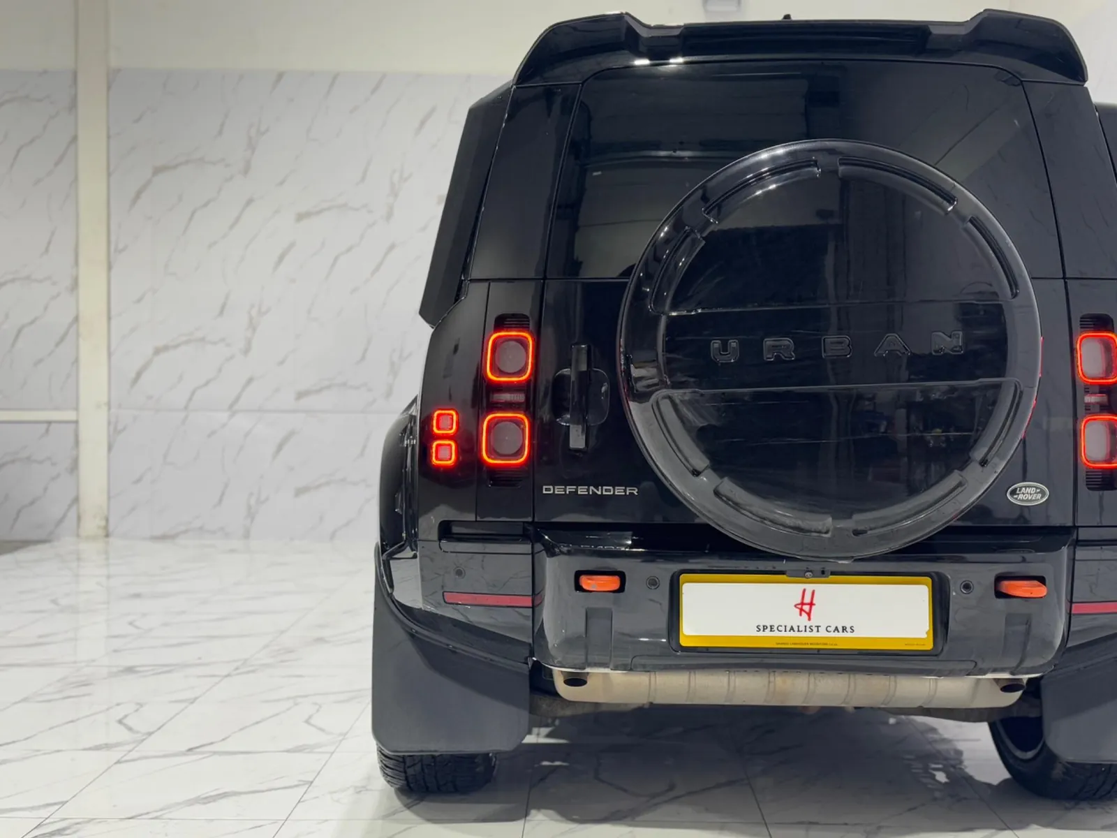 2023 Land Rover Defender 110 — Rear view from slightly further back