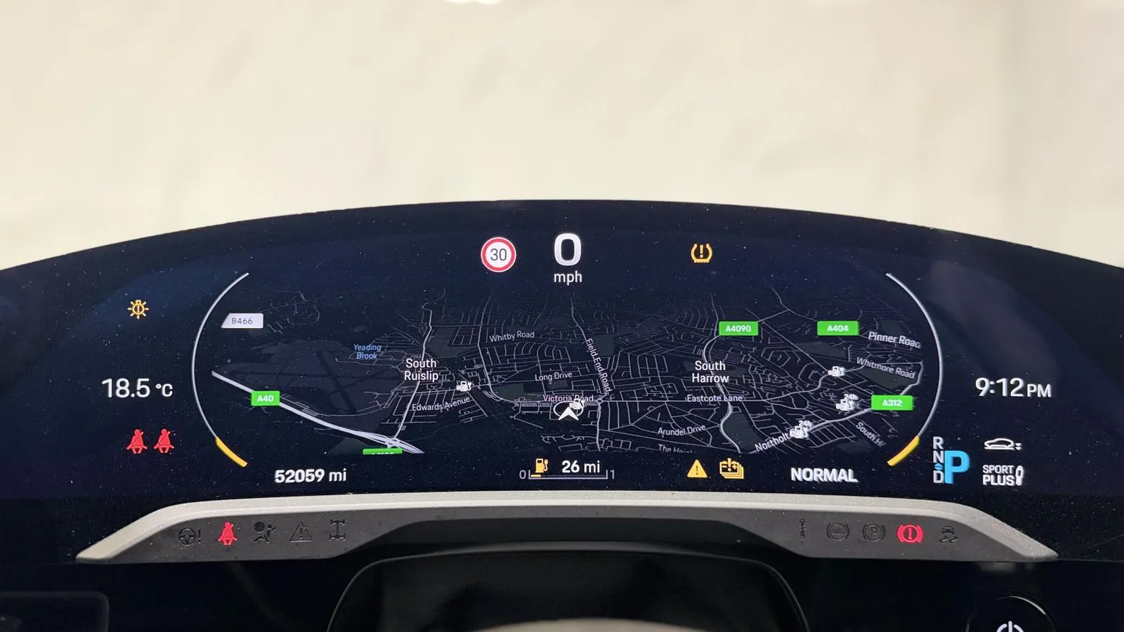 2021 Porsche Taycan — Curved instrument display showing 0 mph, the navigation map and 52,009 miles