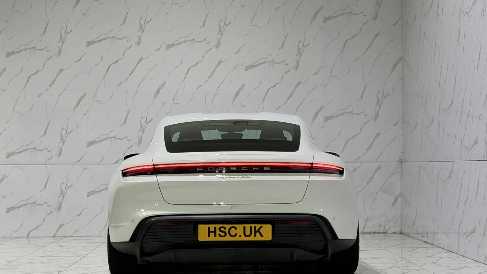 2021 Porsche Taycan — Rear view showing the full-width light bar
