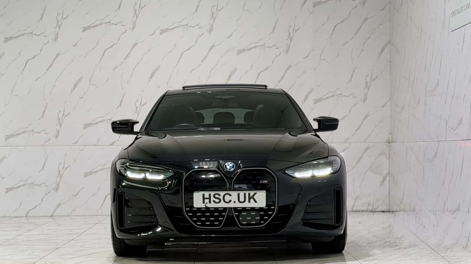 2023 BMW i4 — Head-on view of the grille and headlights