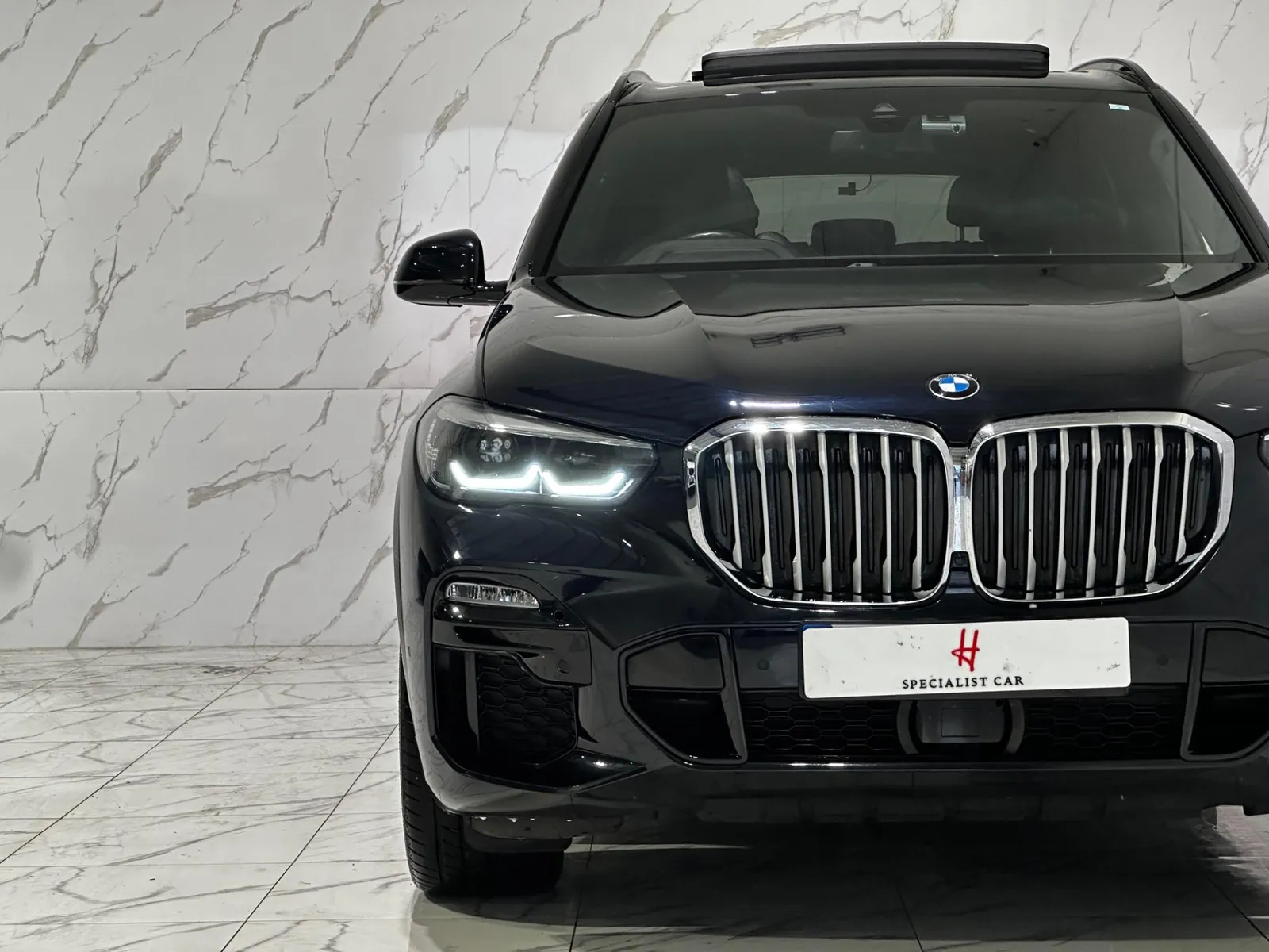 2019 BMW X5 — Head-on view from slightly closer, showing the number plate
