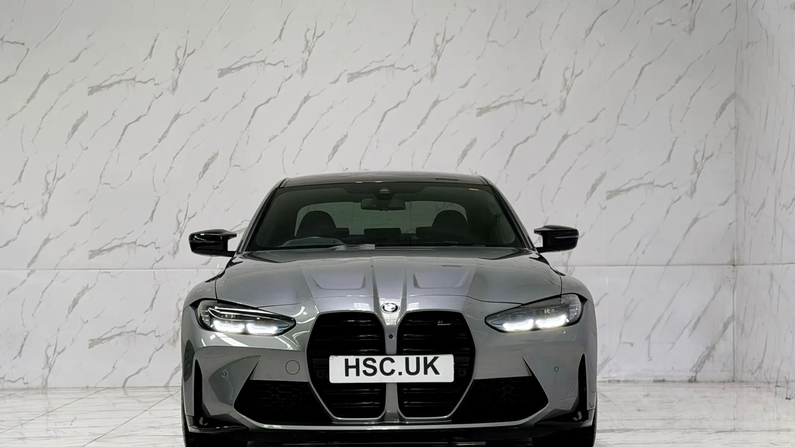 2022 BMW M3 — Head-on view of the grille and headlights
