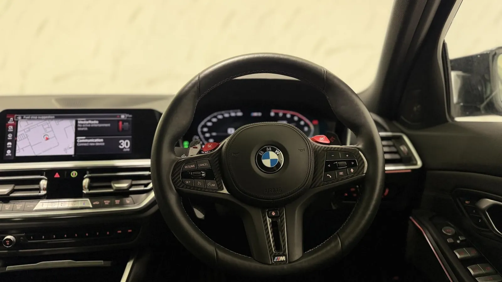 2022 BMW M3 — Steering wheel and centre screen from the driver's seat