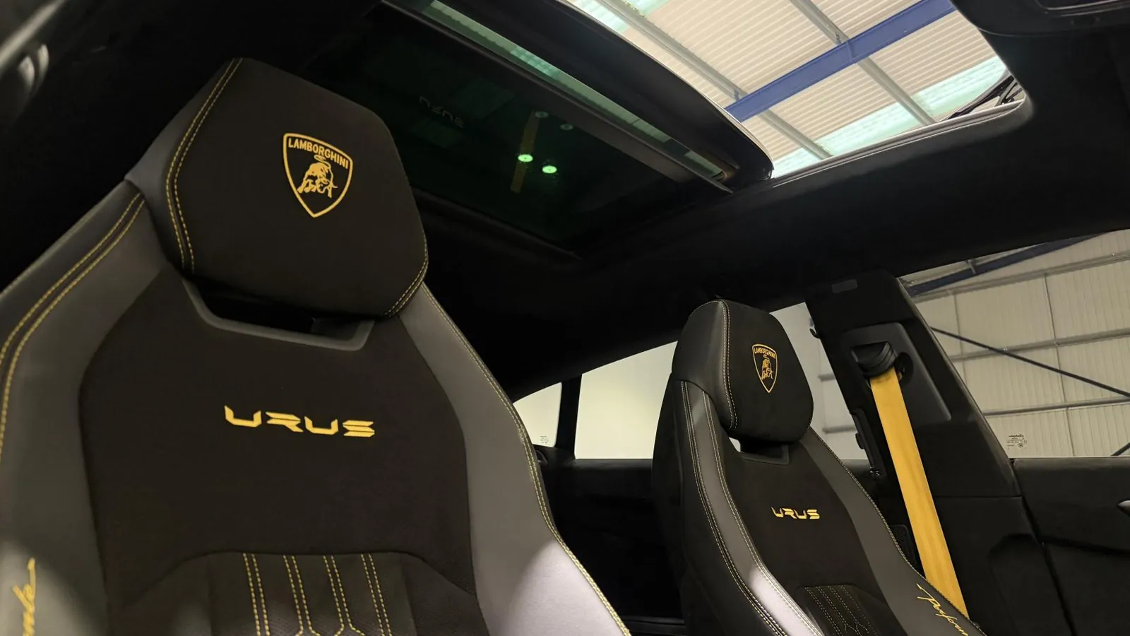 2024 Lamborghini Urus — Front seats beneath the panoramic roof