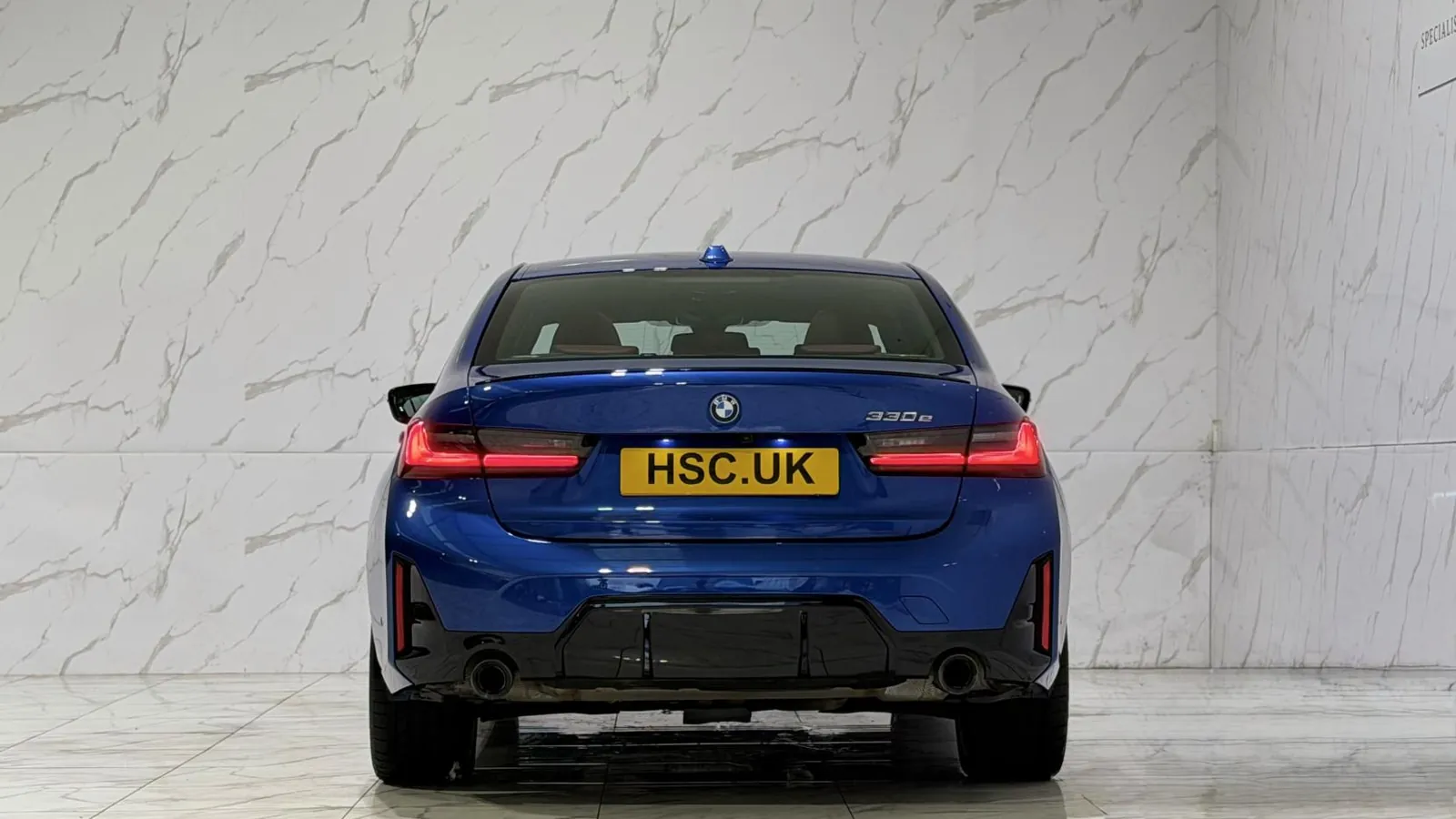 2025 BMW 3 Series — Rear view showing the tail lights and lower valance
