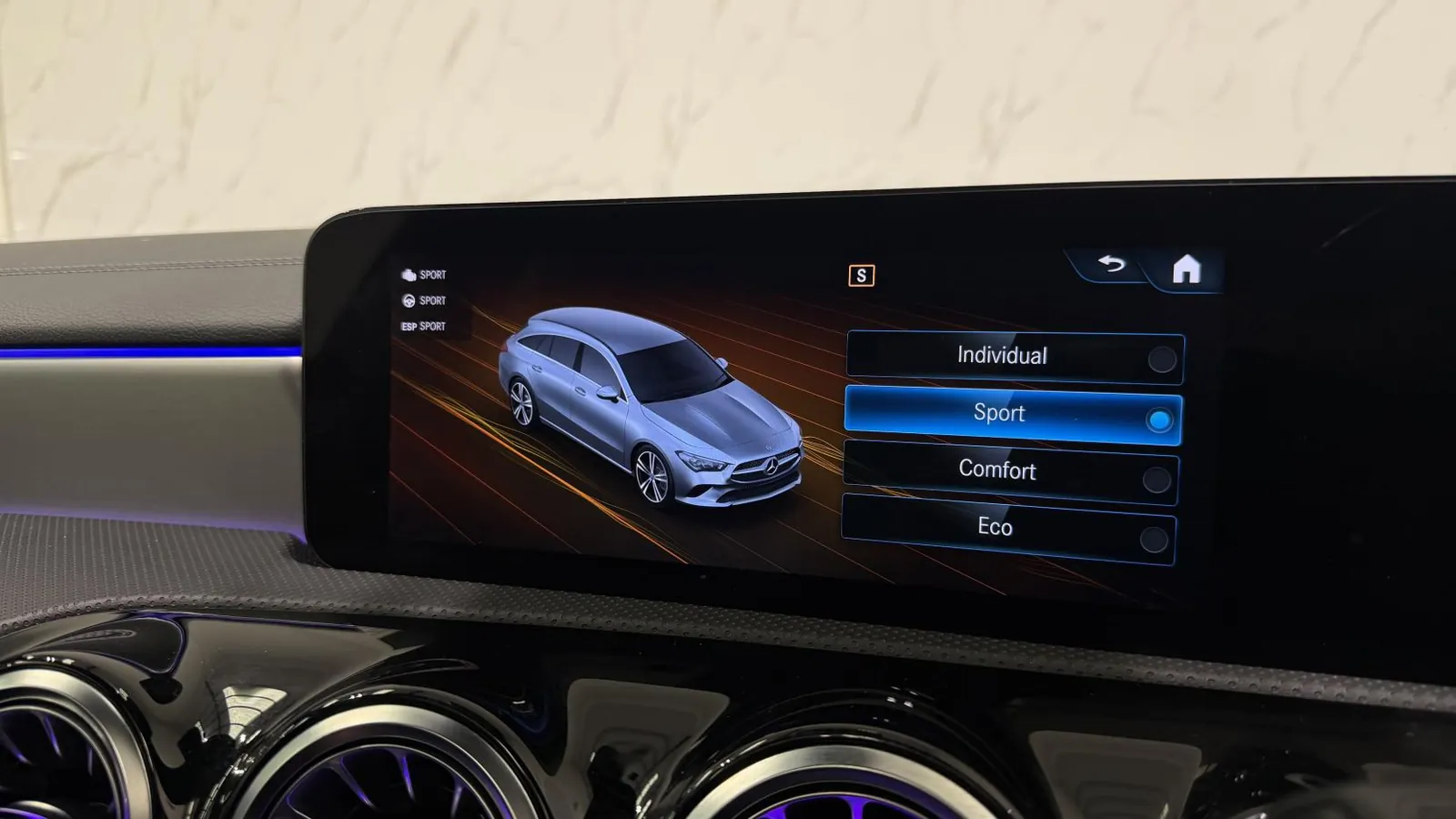 2022 Mercedes-Benz CLA — Centre screen showing the drive-mode menu, above the air vents