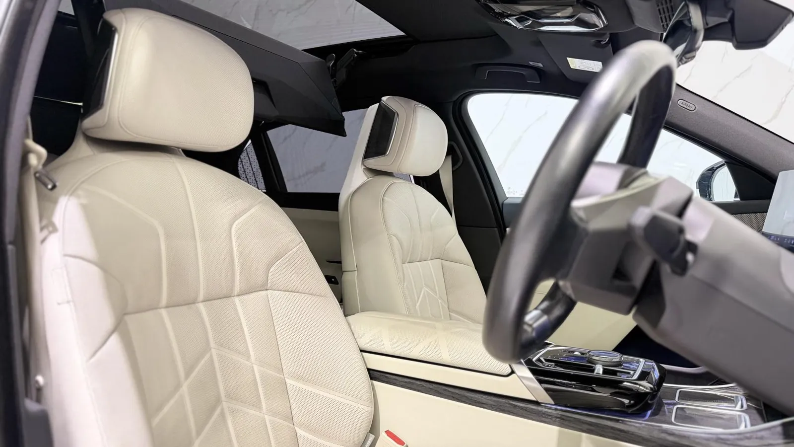 2023 BMW i7 — Front seats and steering wheel from the passenger side