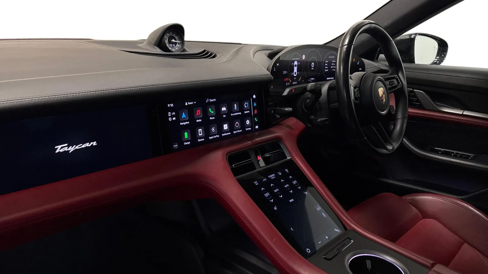 2020 Porsche Taycan — Dashboard and centre console in red leather, seen from the passenger side