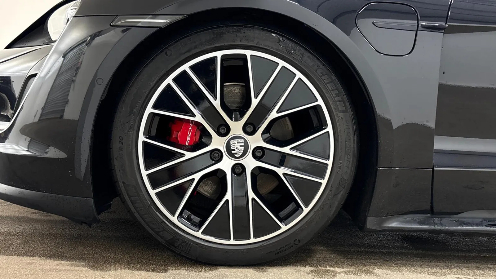 2020 Porsche Taycan — Close view of the front wheel and red brake caliper