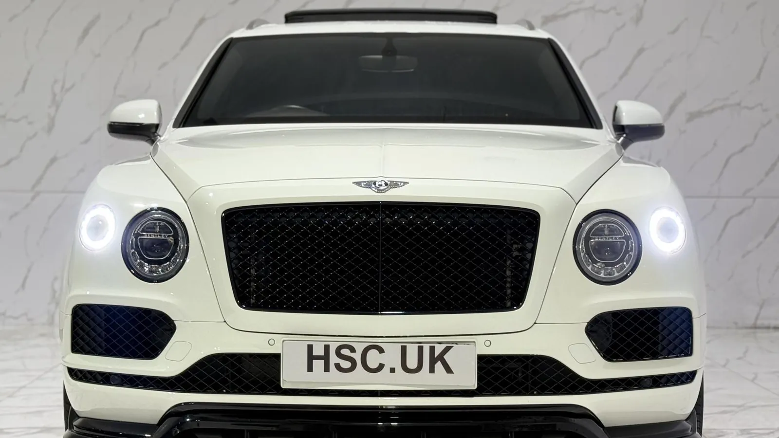 2019 Bentley Bentayga — Head-on view of the black grille and round headlights