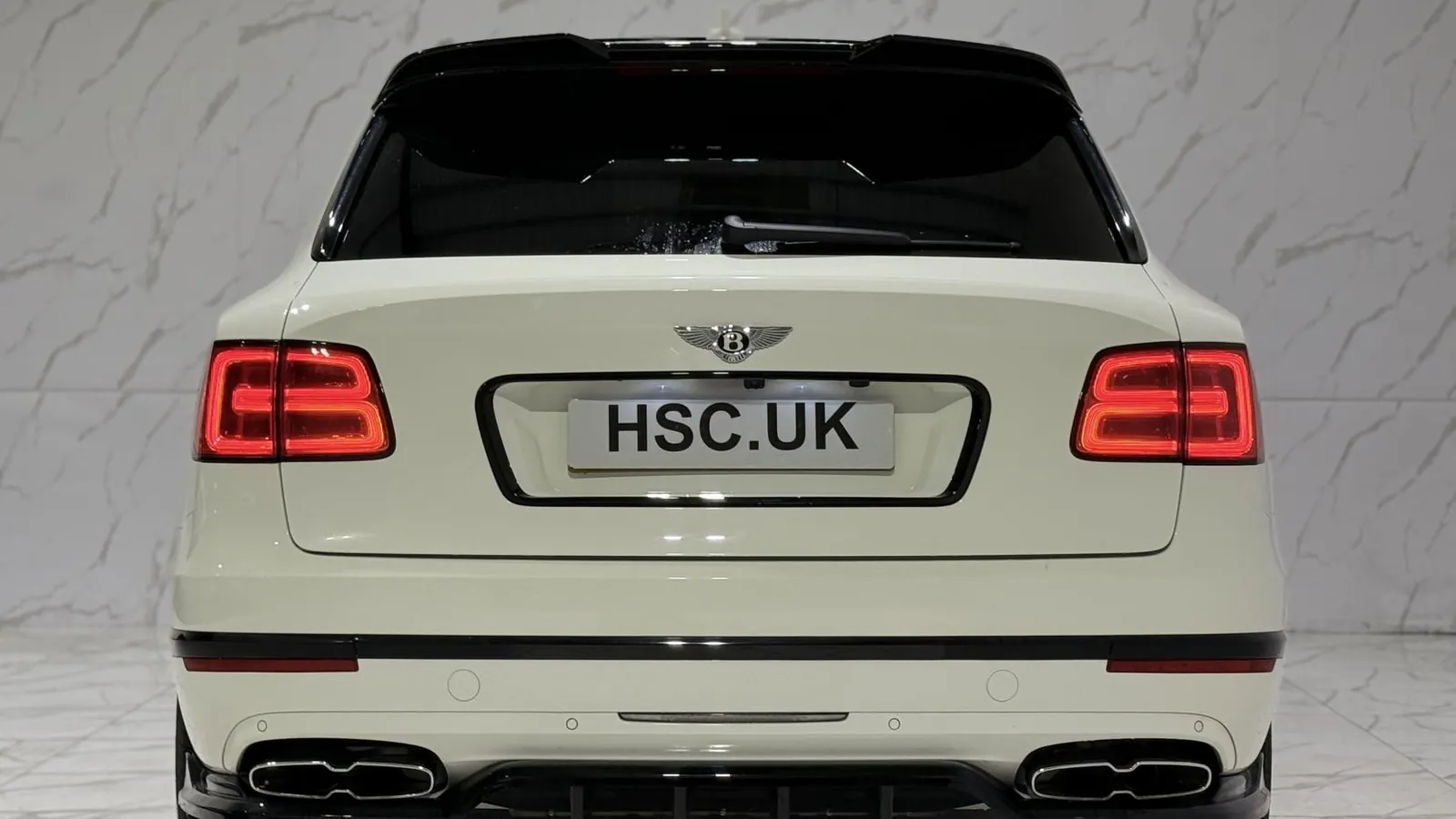 2019 Bentley Bentayga — Rear view showing the tail lights and twin exhaust outlets