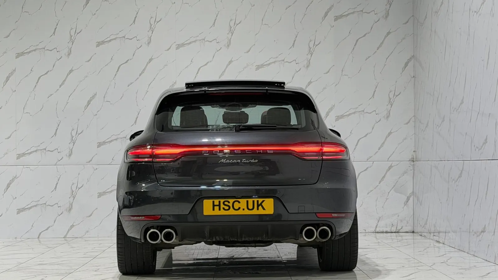 2019 Porsche Macan — Rear view showing the tail light bar and twin exhaust outlets