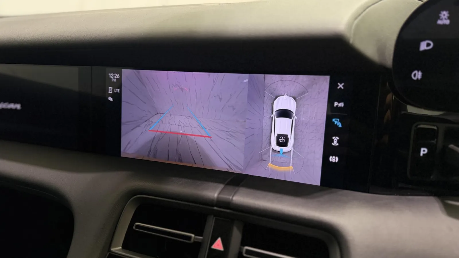 2020 Porsche Taycan — Centre screen showing the reversing camera and overhead view