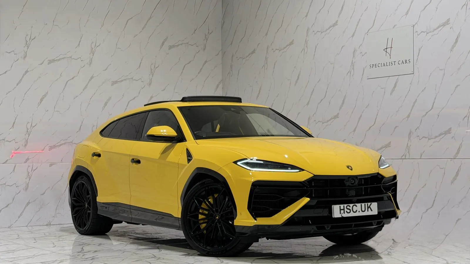 2025 Lamborghini Urus — Front three-quarter view of the yellow Urus SE