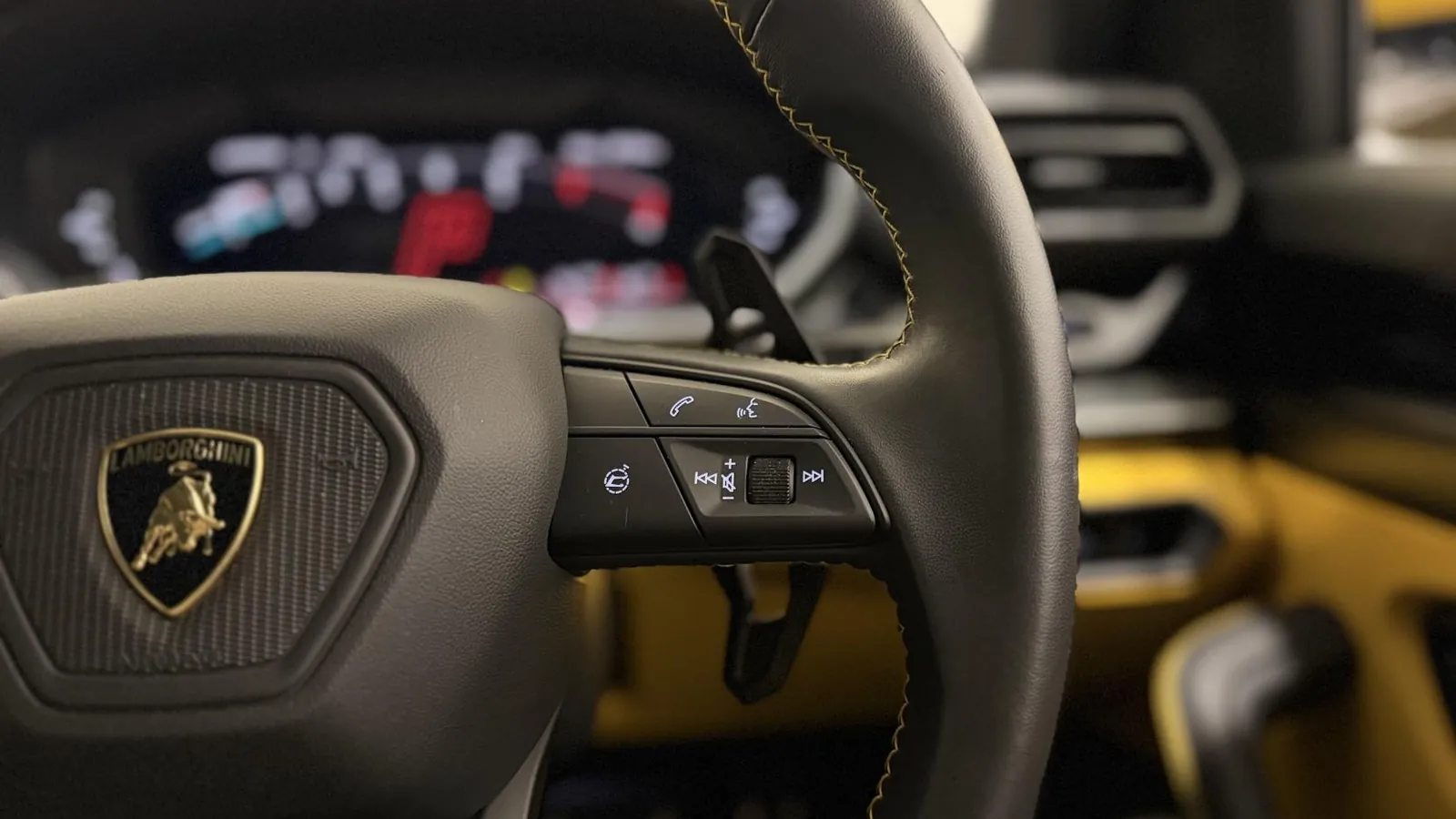 2025 Lamborghini Urus — Steering wheel with the instrument cluster behind