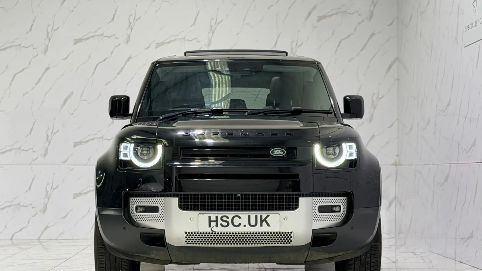 2020 Land Rover Defender 110 — Head-on view of the grille and round headlights