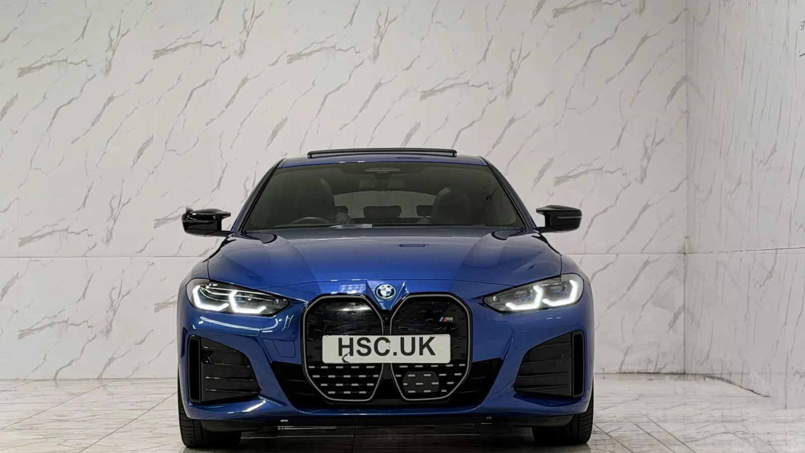 2023 BMW i4 — Head-on view of the grille and headlights