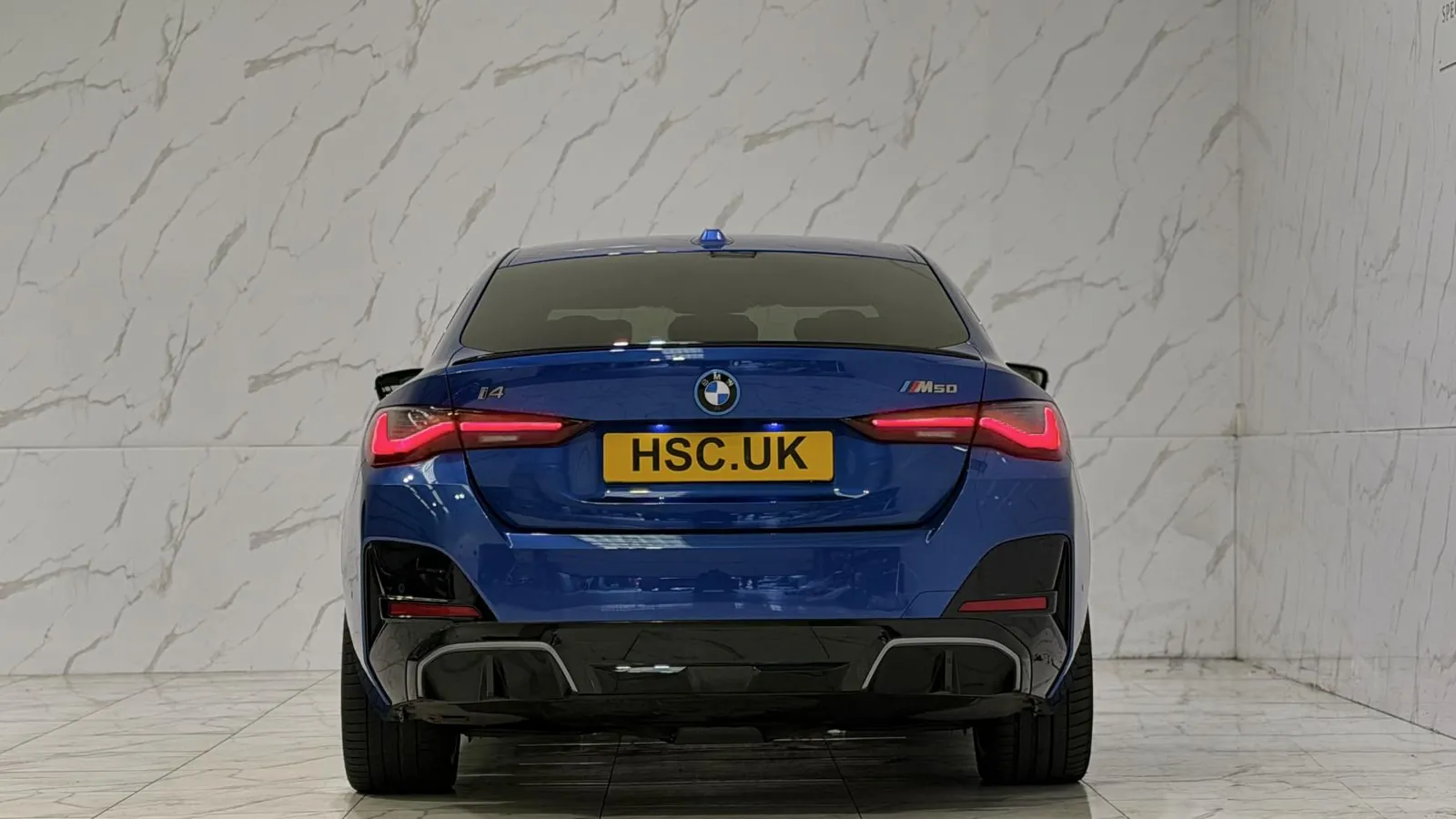 2023 BMW i4 — Rear view showing the tail lights and lower valance