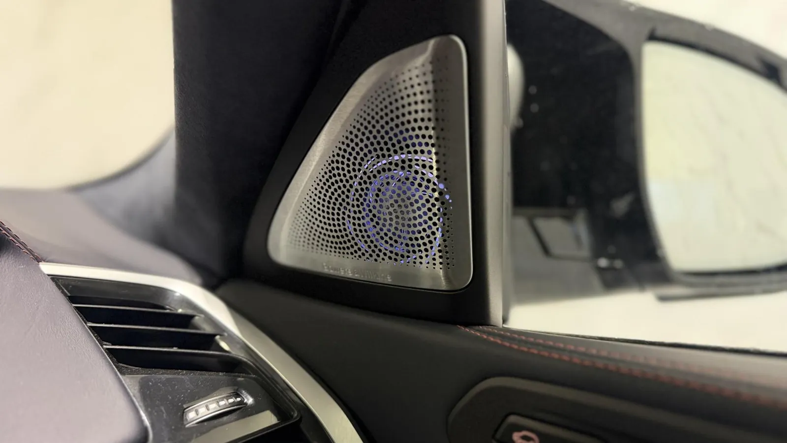 2022 BMW X6 M — Close view of a speaker grille in the door mirror sail panel