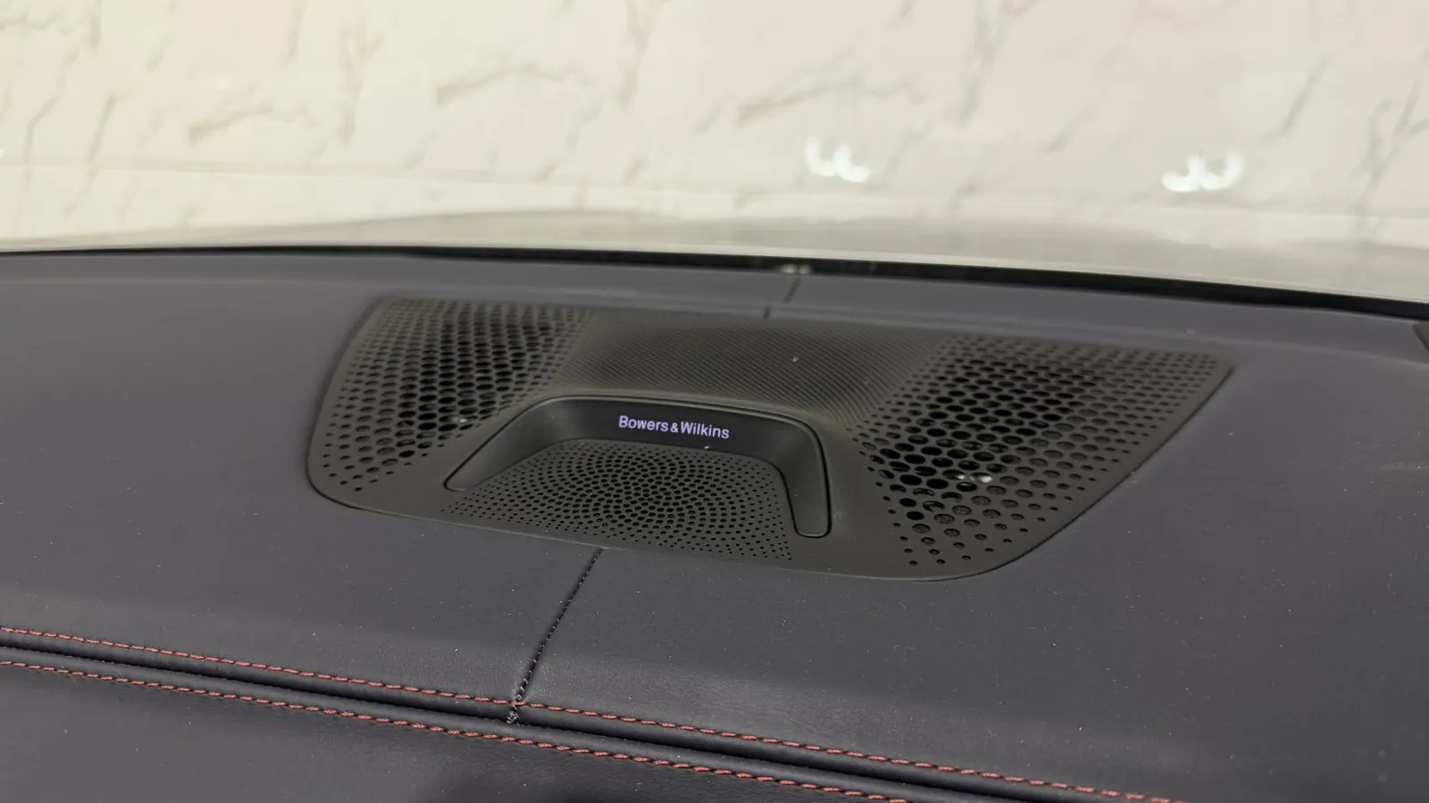 2022 BMW X6 M — Bowers & Wilkins speaker grille set into the dashboard top