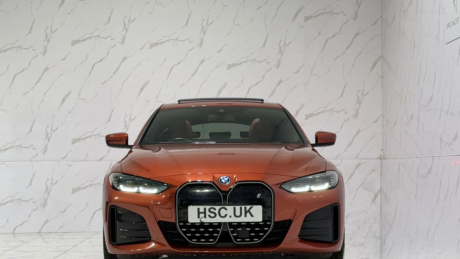 2023 BMW i4 — Head-on view of the grille and headlights