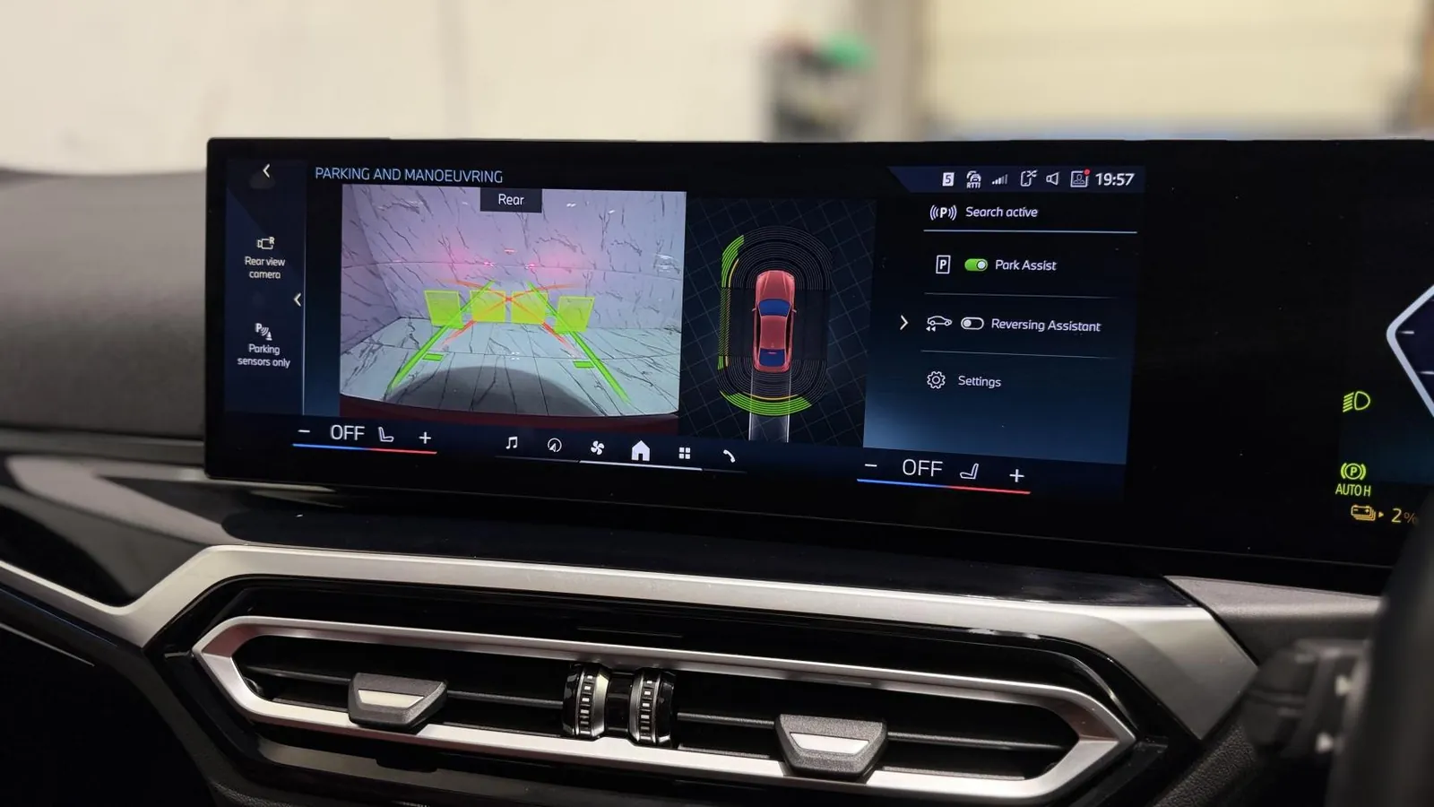 2023 BMW i4 — Centre screen showing the parking camera and overhead view