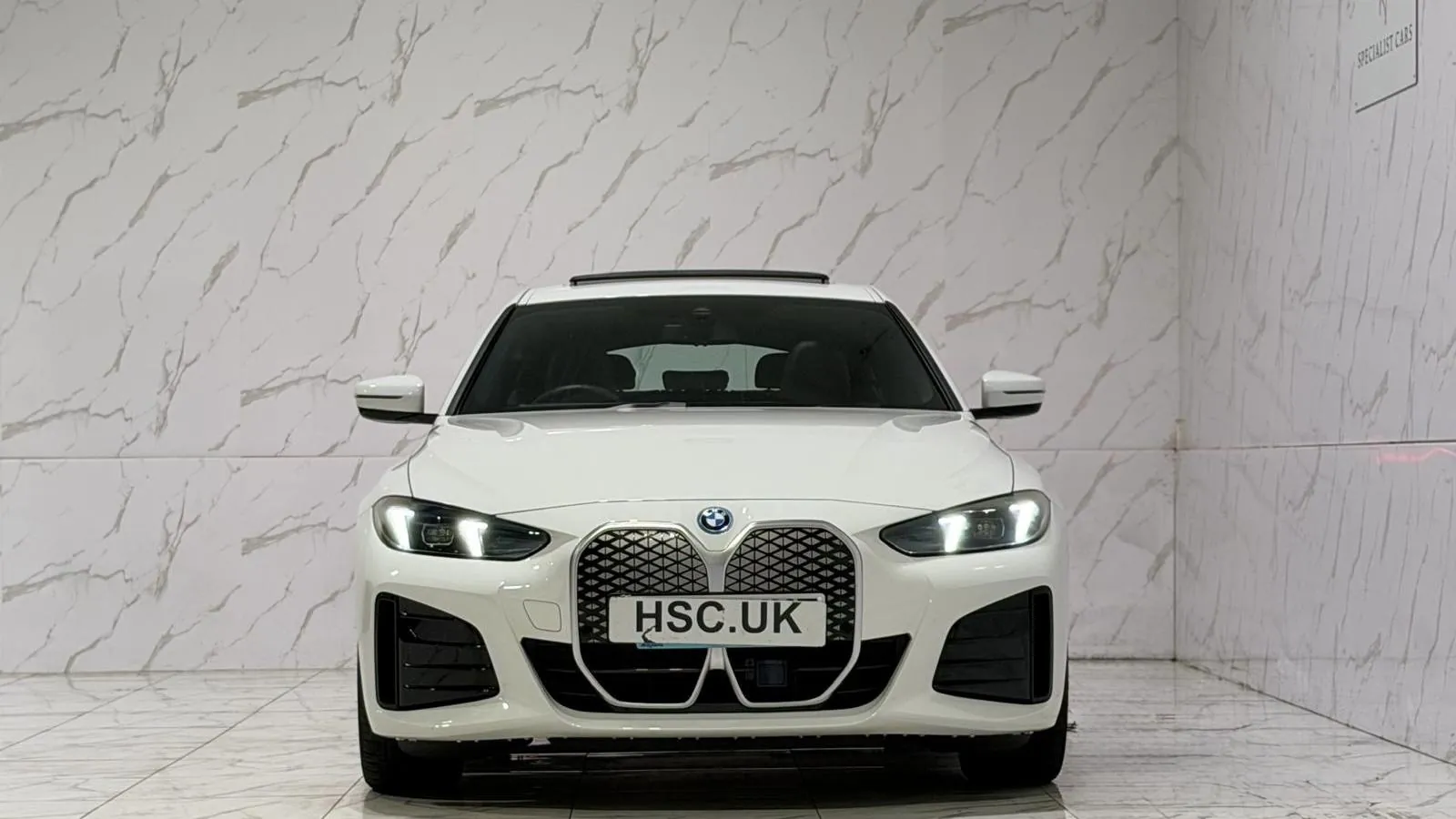 2025 BMW i4 — Head-on view of the grille and headlights