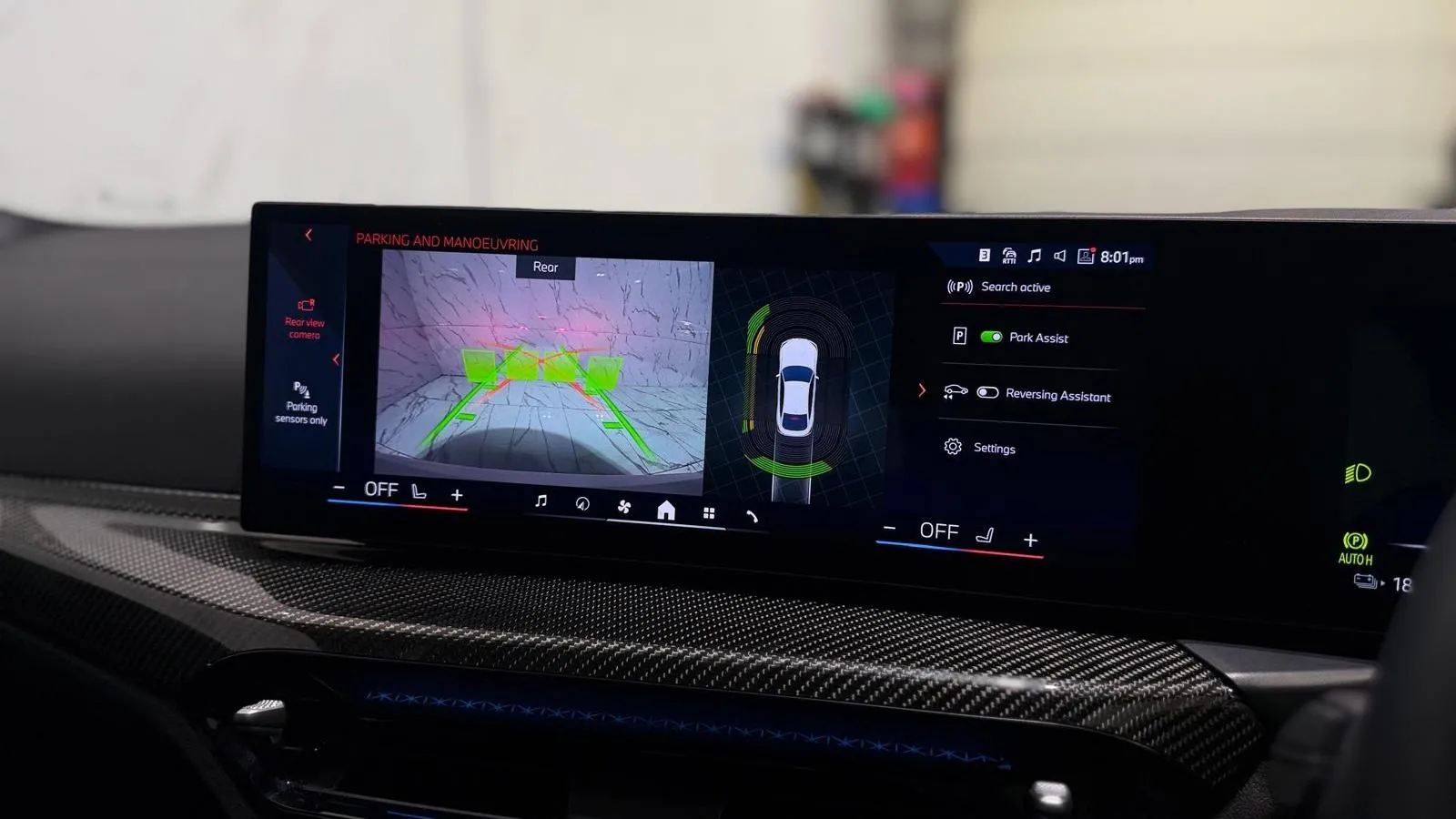 2025 BMW i4 — Centre screen showing the parking camera and overhead view