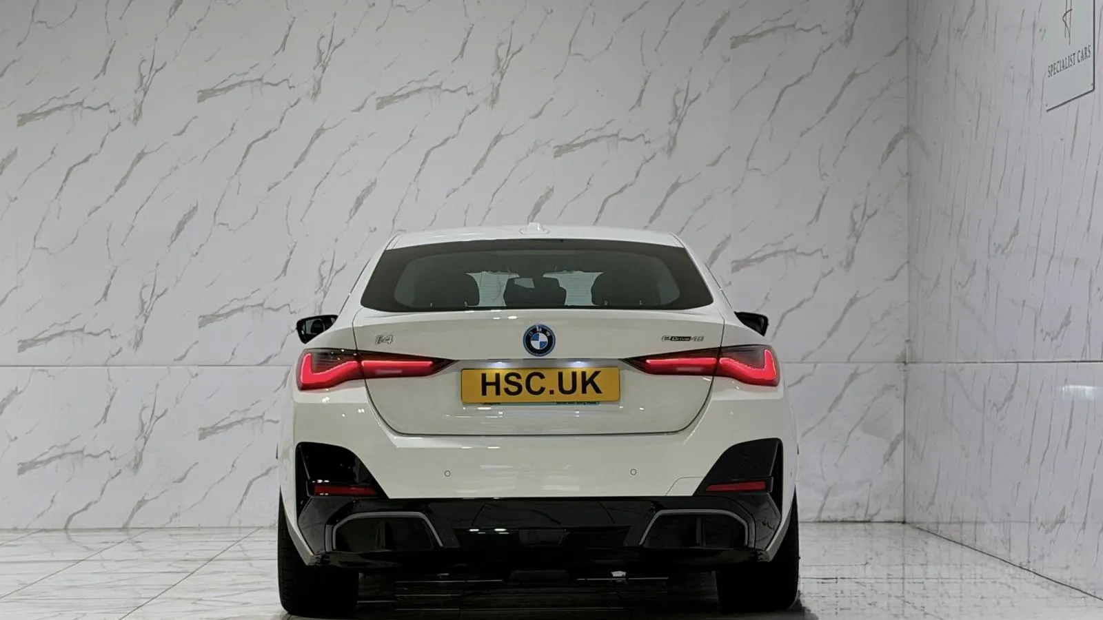 2025 BMW i4 — Rear view showing the tail lights and lower valance