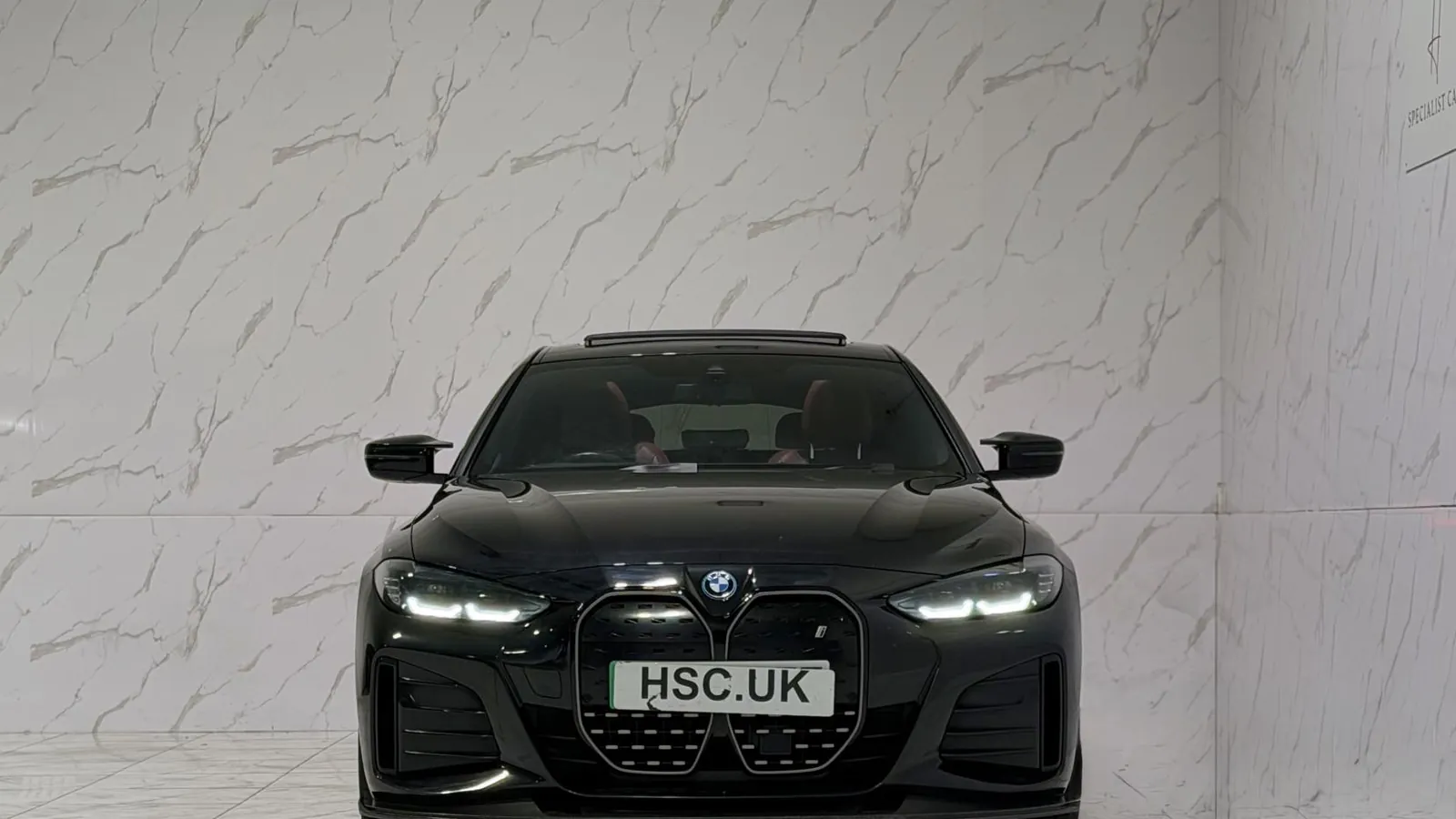 2023 BMW i4 — Head-on view of the grille and headlights