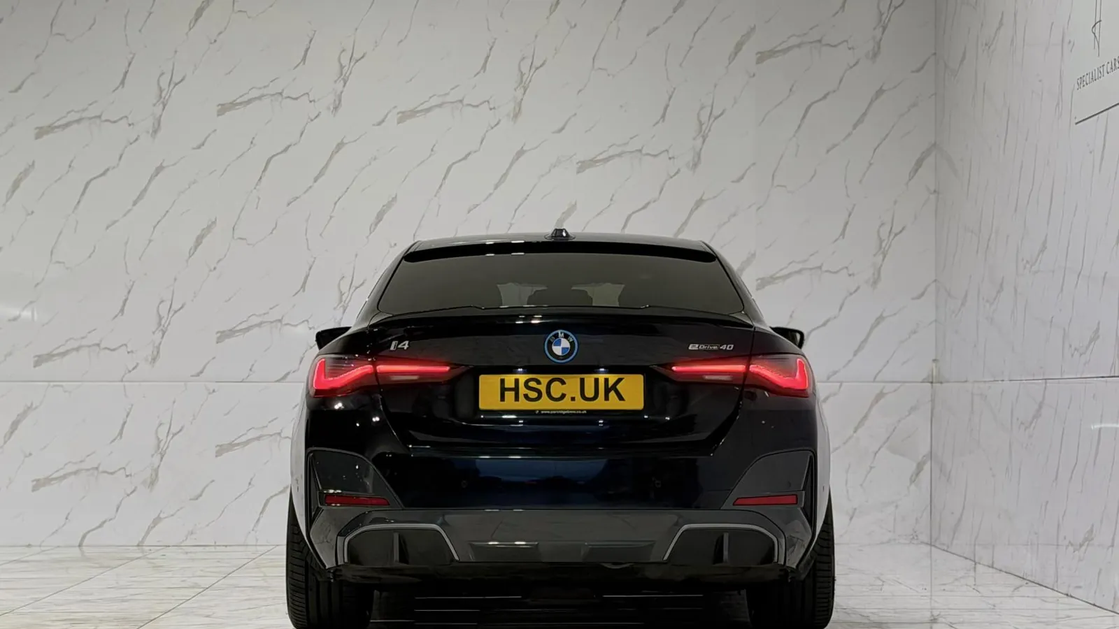 2023 BMW i4 — Rear view showing the tail lights and lower valance