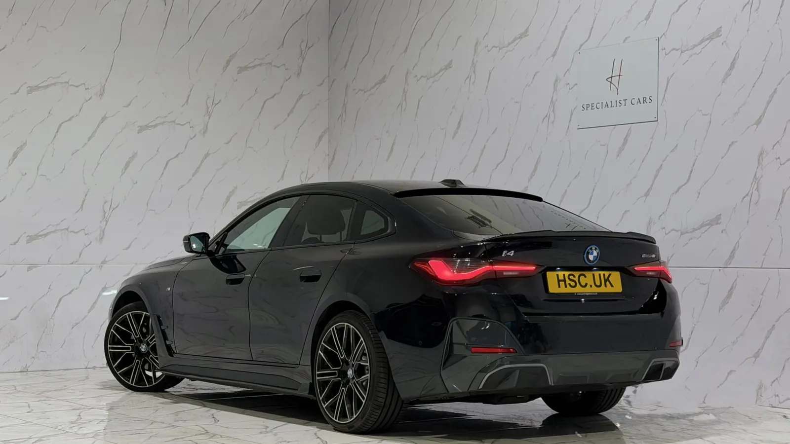 2023 BMW i4 — Rear three-quarter view from the offside