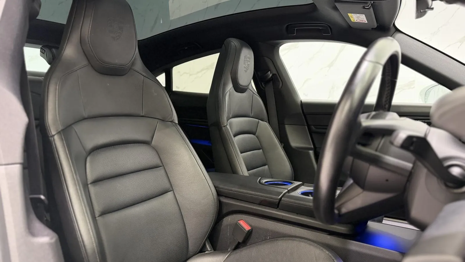 2020 Porsche Taycan — Front seats and steering wheel from the rear offside