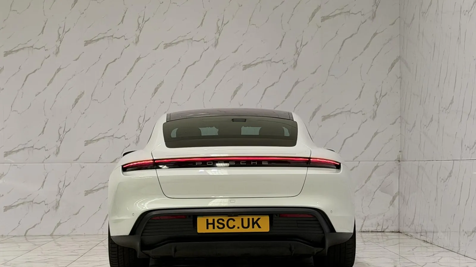 2020 Porsche Taycan — Rear view showing the full-width light bar