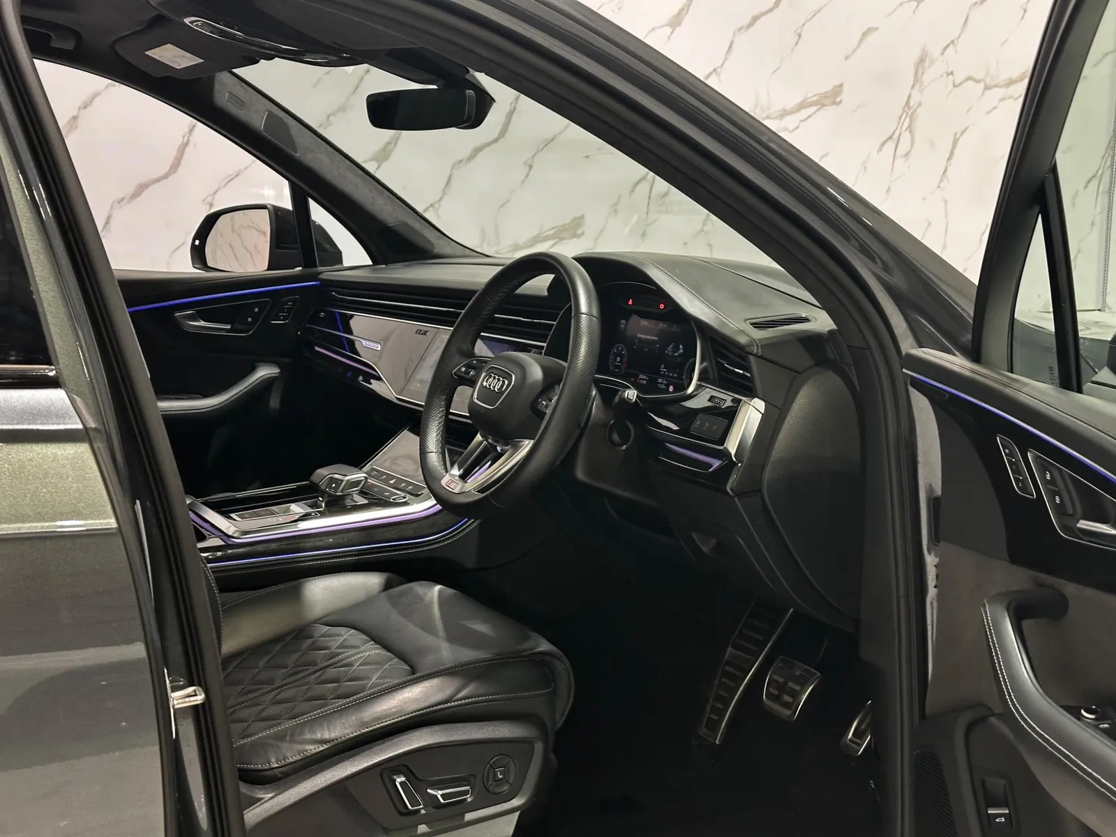 2021 Audi Q7 — Steering wheel and dashboard from the passenger door
