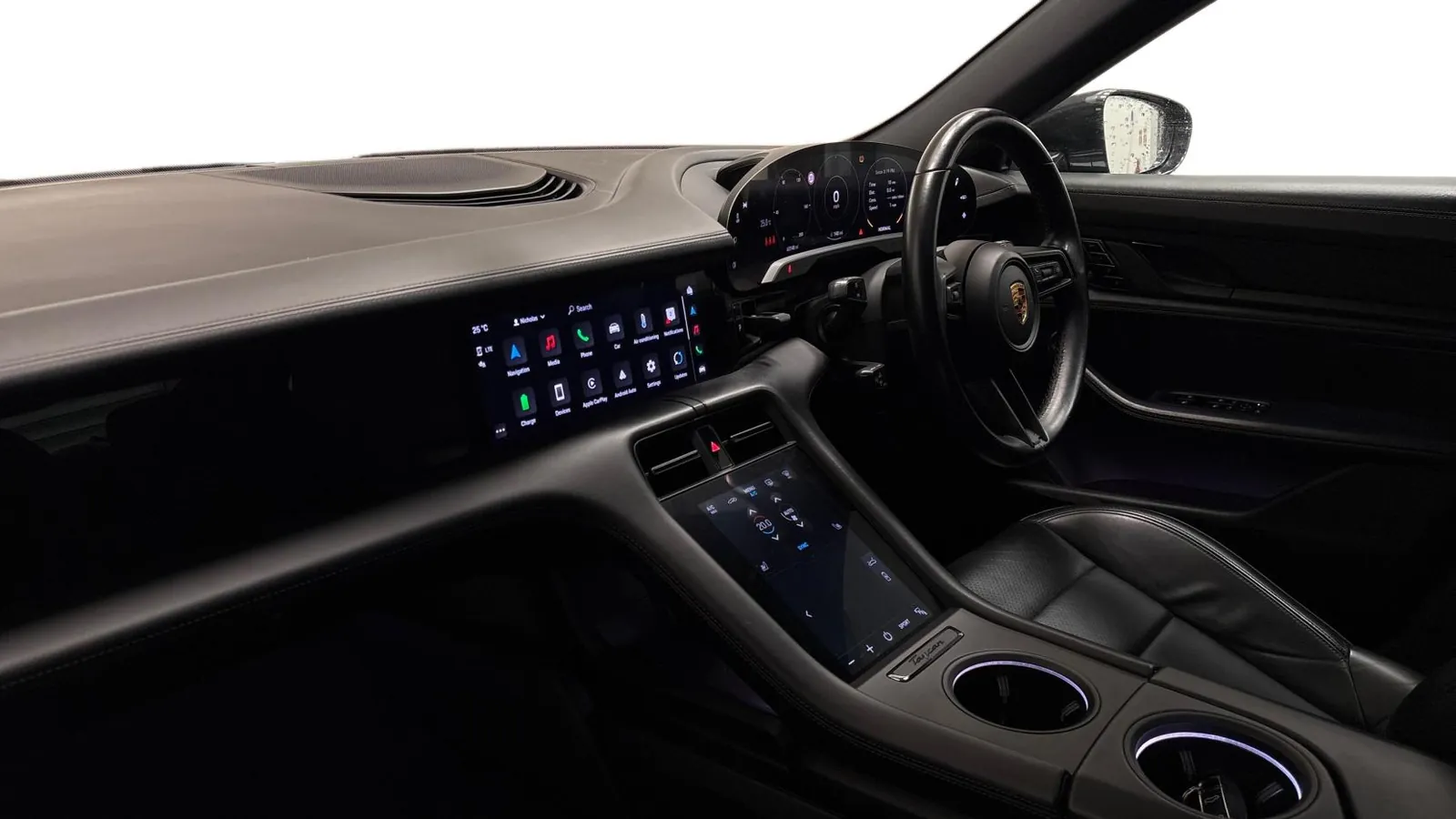 2021 Porsche Taycan — Dashboard and centre console seen from the passenger side