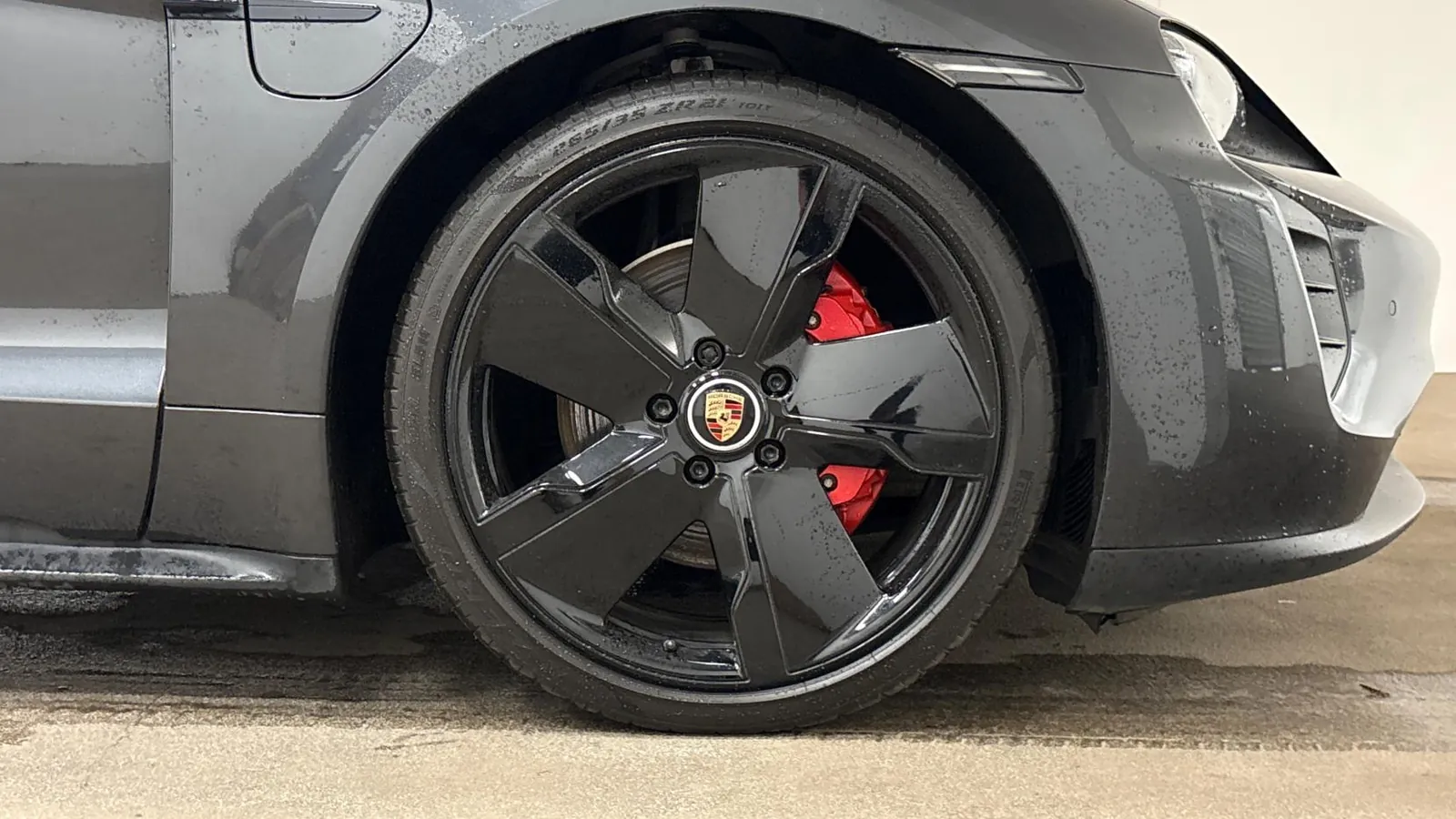 2021 Porsche Taycan — Close view of the rear wheel and red brake caliper