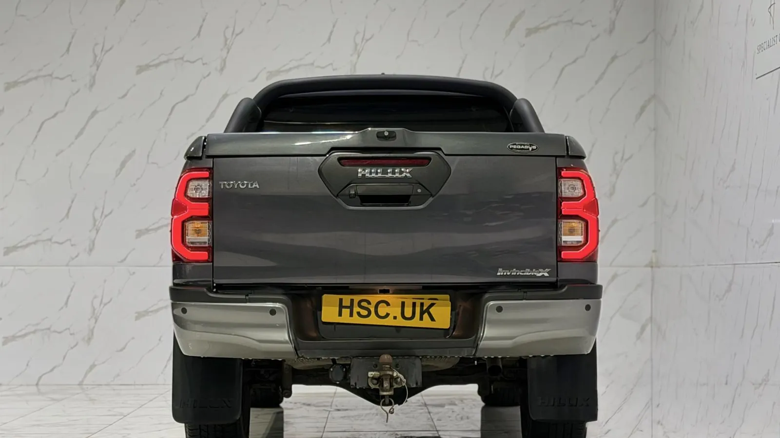 2023 Toyota Hilux — Rear view showing the tailgate and tail lights